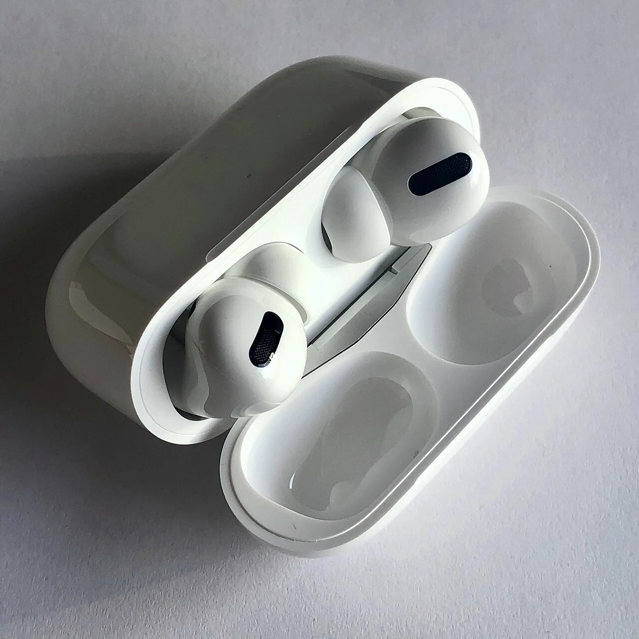 First-generation AirPods Pro in their open charging case.